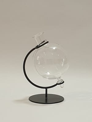 Glass orb in cradle